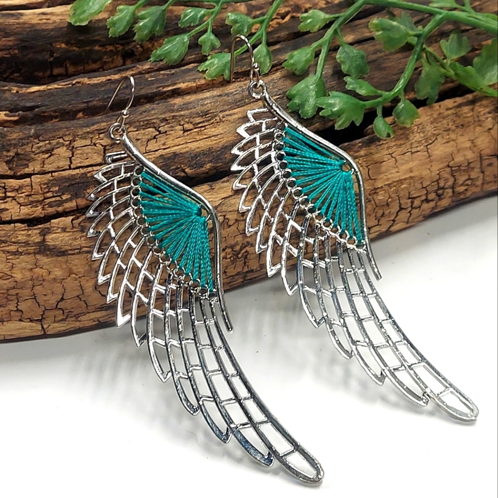 E1043 Teal String Spun Silvertone Wings Dangle Earrings